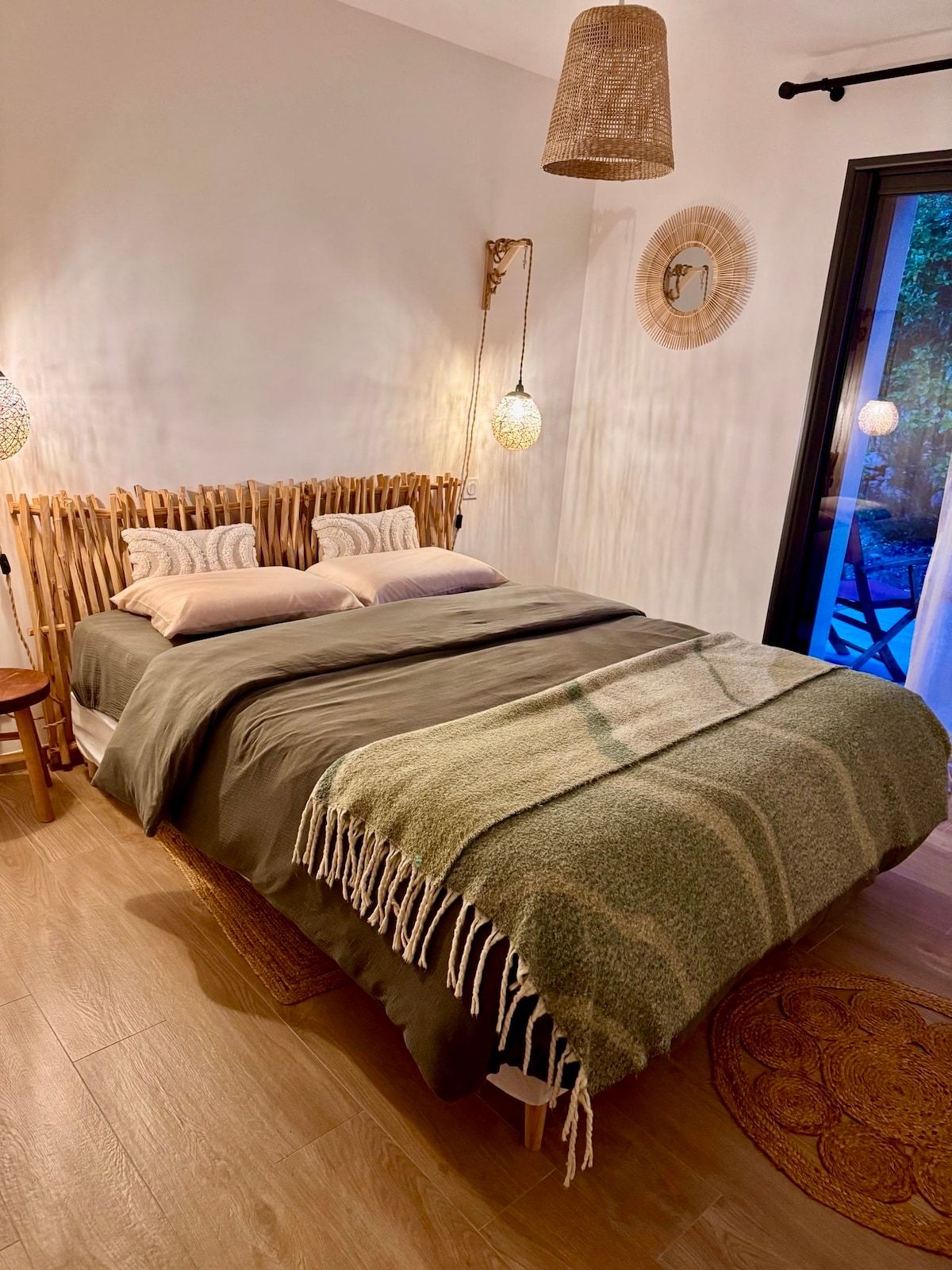 Bedroom with 160 cm bed, olive-green throw and French window