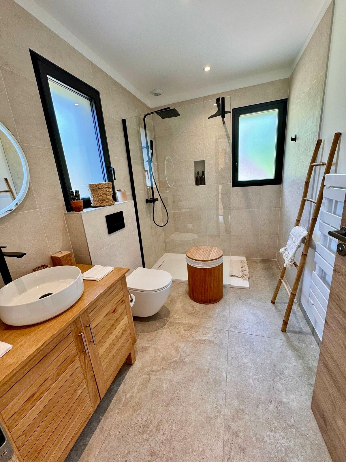 Bright shower room with wooden towel ladder